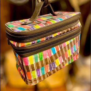 Julep duo compartment cosmetics case with two zipper divided storage areas.